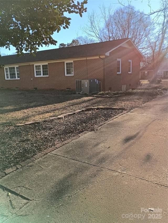 rear view of house with cooling unit