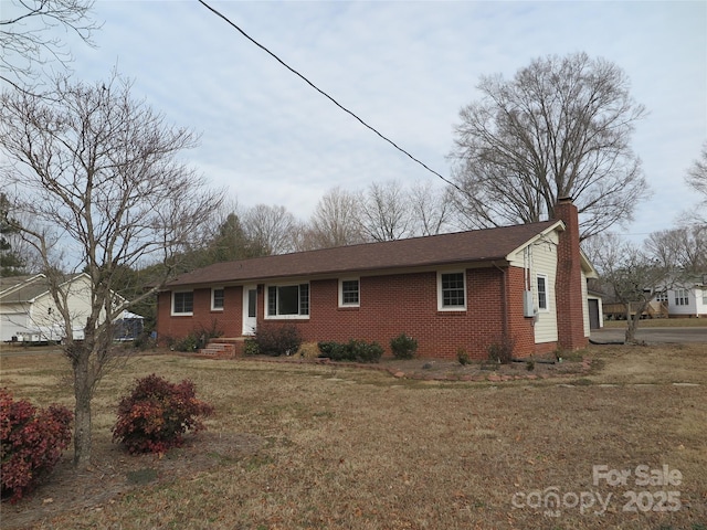 ranch-style house with a front lawn