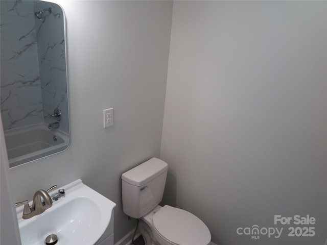 bathroom with sink and toilet