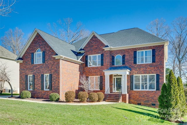 colonial-style house with a front yard