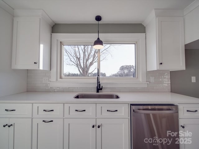 kitchen featuring white cabinets, dishwasher, and sink