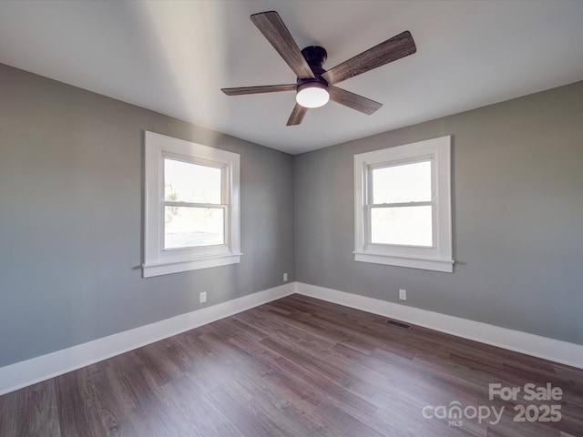 unfurnished room featuring ceiling fan and hardwood / wood-style floors