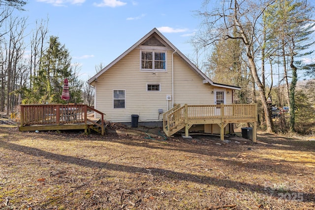 back of house featuring a deck