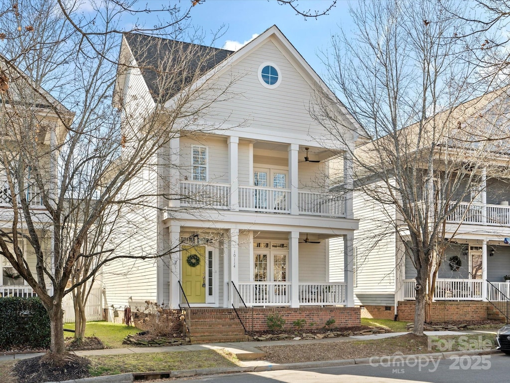 view of front of house featuring a balcony and a porch