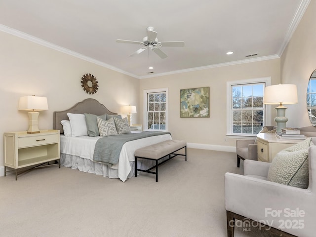 bedroom with ceiling fan, crown molding, and carpet floors