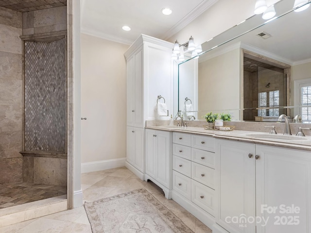 bathroom with tile patterned floors, ornamental molding, tiled shower, and vanity