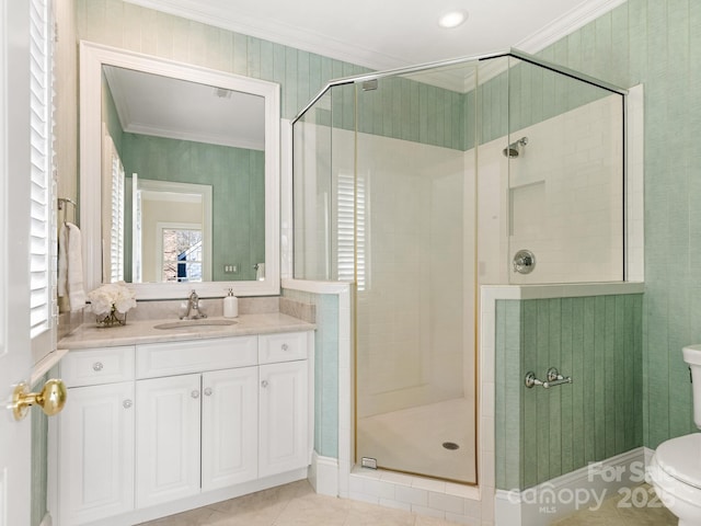 bathroom featuring an enclosed shower, tile patterned floors, vanity, toilet, and crown molding