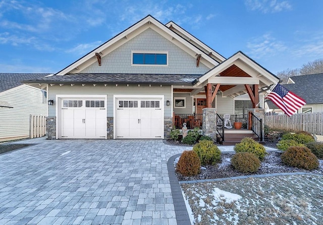 view of front of property with a garage and covered porch