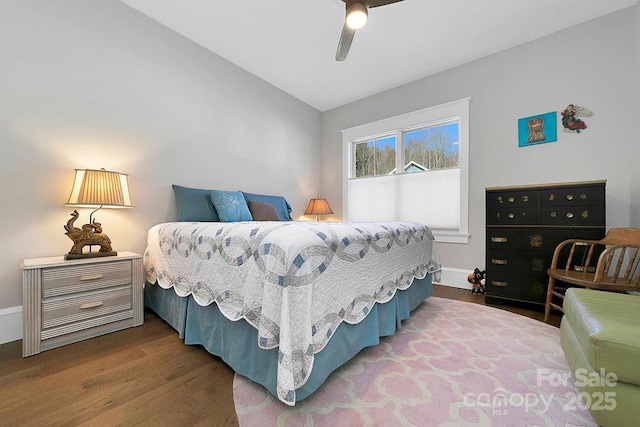 bedroom featuring vaulted ceiling, hardwood / wood-style floors, and ceiling fan