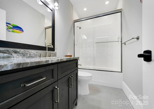 full bathroom featuring shower / bath combination with glass door, tile patterned floors, vanity, and toilet