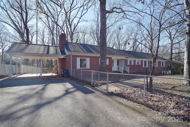 single story home with a carport