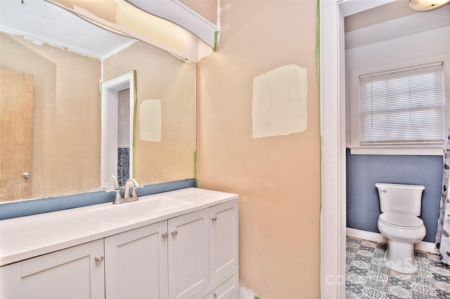 bathroom with vanity and toilet