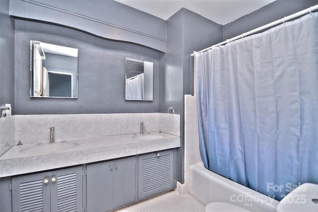 full bathroom with shower / bath combo, tile patterned flooring, vanity, and toilet