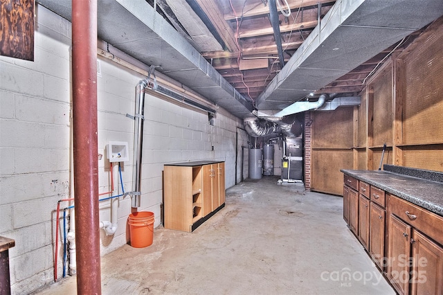 basement featuring water heater