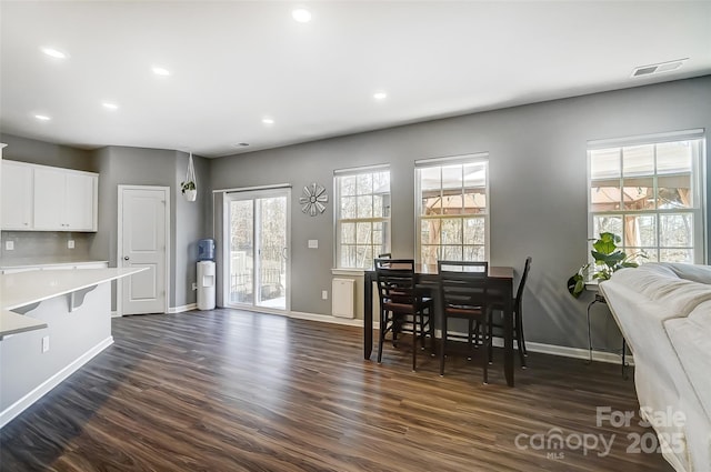 dining space featuring dark hardwood / wood-style floors