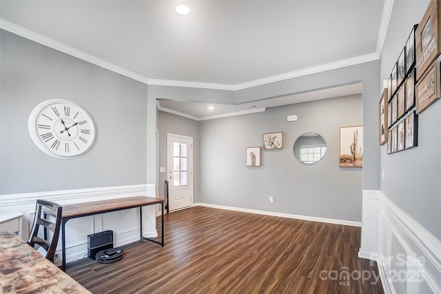 entrance foyer featuring crown molding and dark wood-type flooring