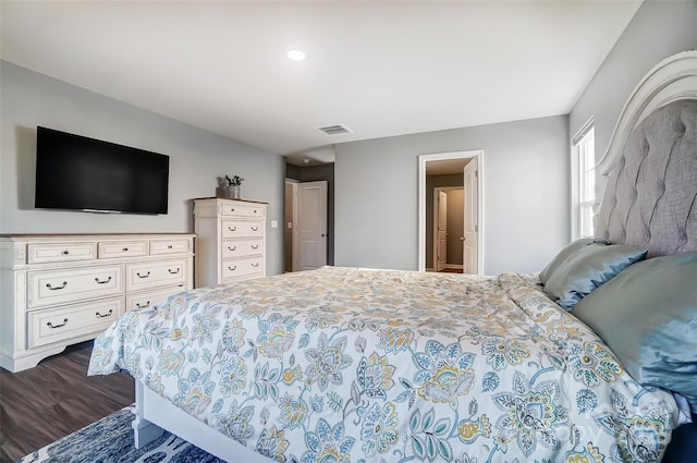 bedroom featuring dark hardwood / wood-style floors