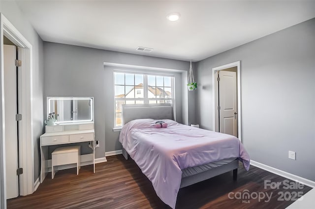 bedroom featuring dark wood-type flooring