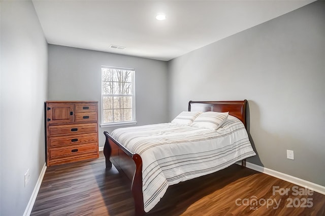 bedroom featuring dark hardwood / wood-style flooring