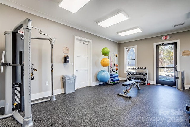 exercise room featuring crown molding