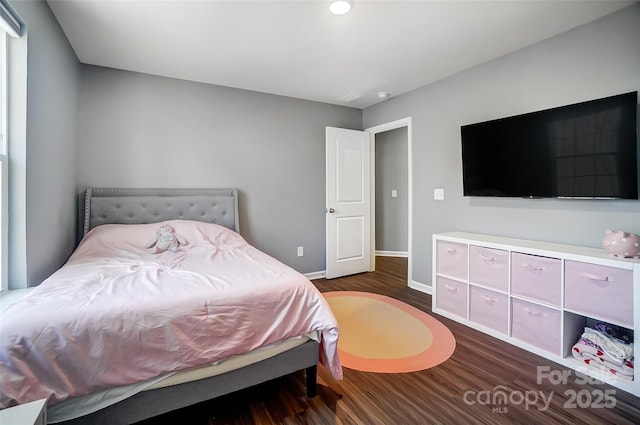 bedroom featuring dark hardwood / wood-style flooring