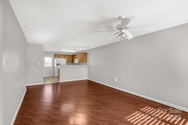 unfurnished living room with ceiling fan and light hardwood / wood-style flooring