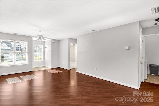 empty room featuring hardwood / wood-style floors and ceiling fan