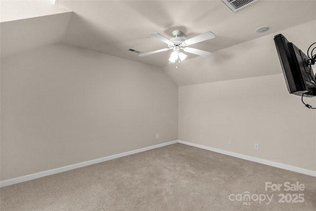 bonus room featuring ceiling fan, lofted ceiling, and light carpet