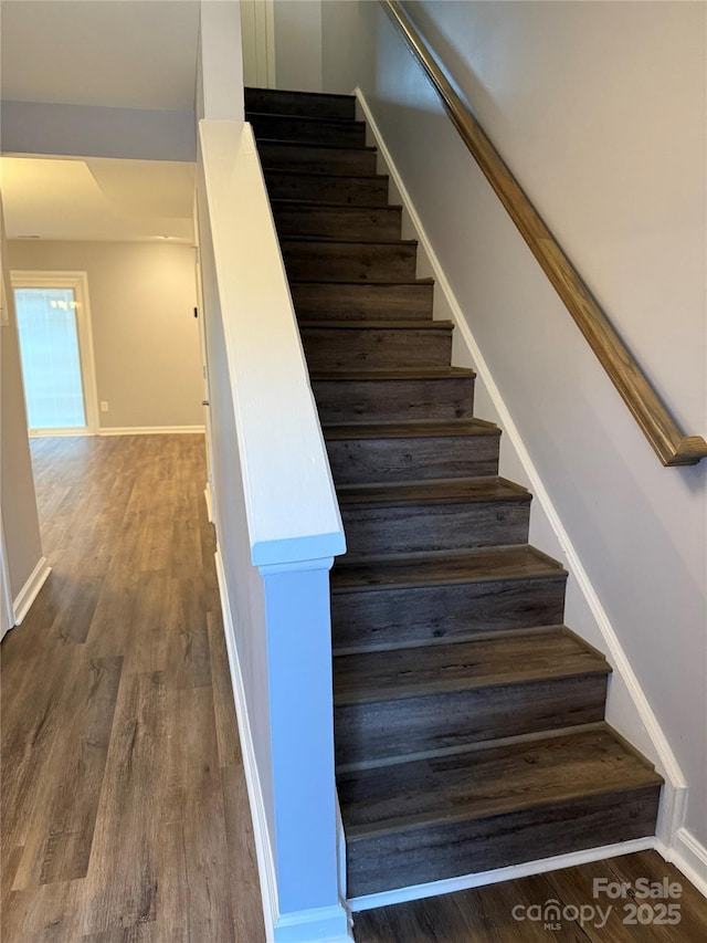 stairway featuring hardwood / wood-style flooring