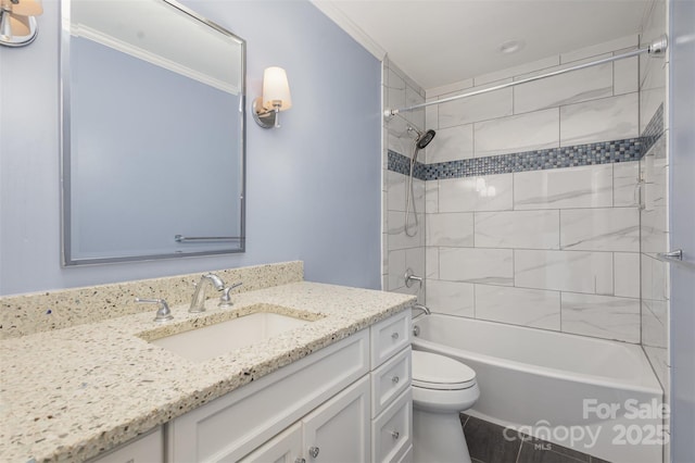 full bathroom featuring toilet, vanity, and tiled shower / bath