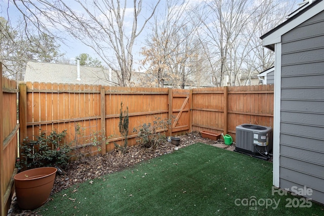 view of yard with central AC unit