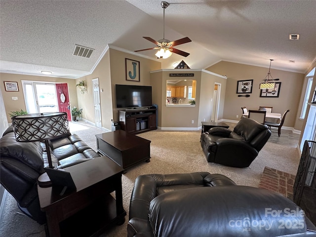 carpeted living room with a textured ceiling, crown molding, ceiling fan, and lofted ceiling