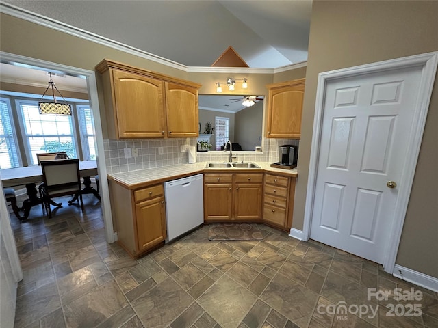 kitchen featuring backsplash, white dishwasher, lofted ceiling, and sink