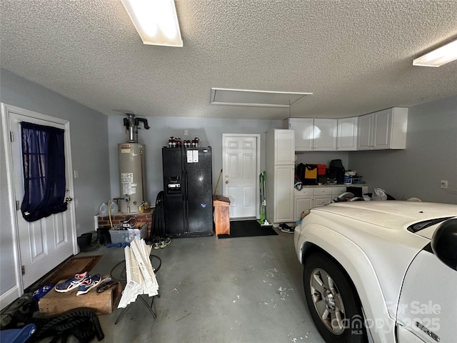 garage featuring gas water heater and black fridge