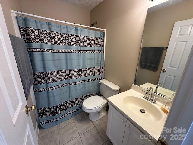 bathroom featuring walk in shower, vanity, a textured ceiling, and toilet