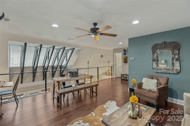 dining area featuring ceiling fan and dark wood-type flooring