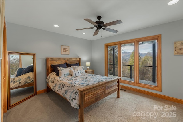 carpeted bedroom with multiple windows and ceiling fan