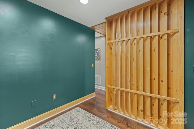 hall featuring dark wood-type flooring