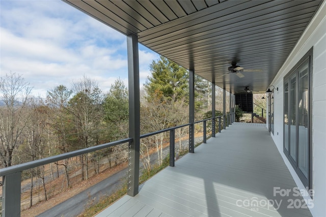 exterior space with ceiling fan