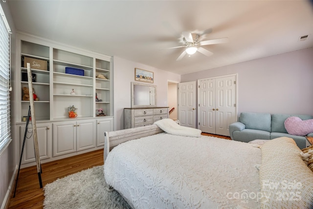 bedroom with ceiling fan, a closet, and hardwood / wood-style floors