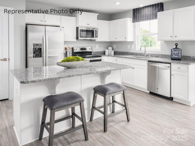 kitchen featuring white cabinets, sink, and appliances with stainless steel finishes