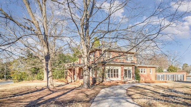 view of front of property with cooling unit and french doors