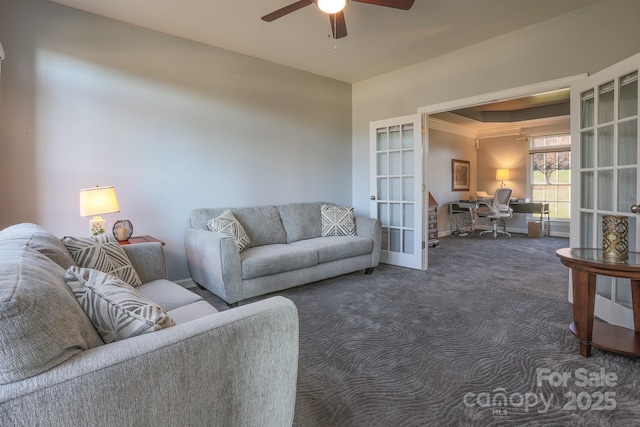 living room with ceiling fan, dark carpet, and french doors