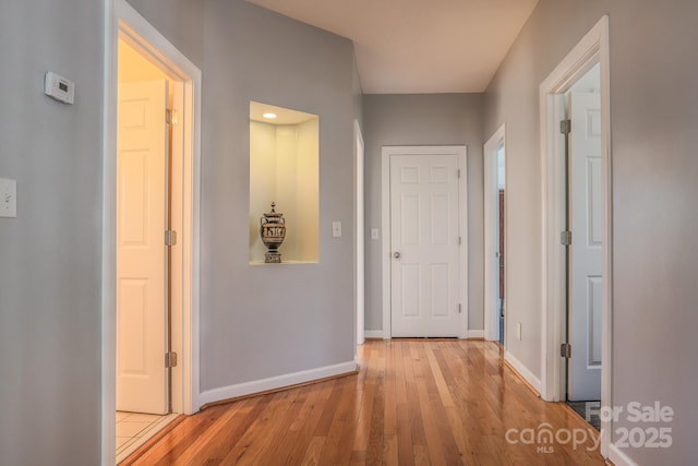 hallway featuring light wood-type flooring