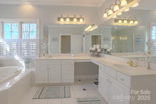 bathroom featuring tile patterned floors, ornamental molding, plus walk in shower, and vanity