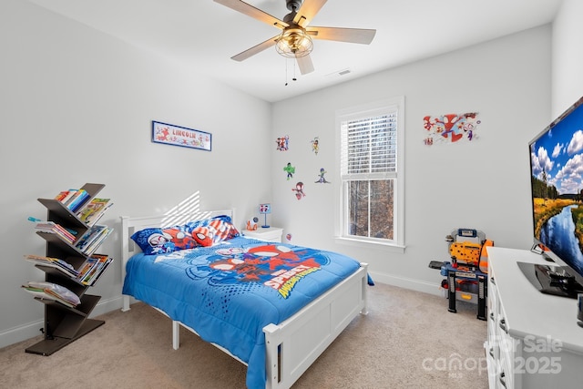 bedroom with ceiling fan and light carpet