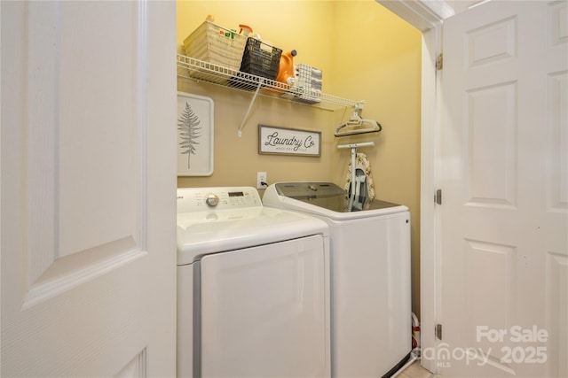 laundry room featuring washer and clothes dryer