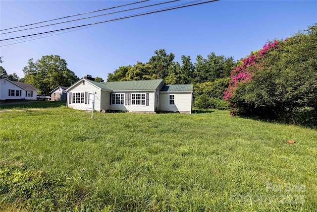 exterior space featuring a front lawn