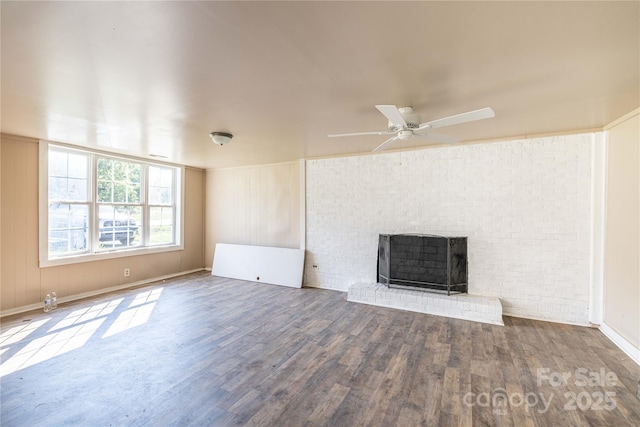 unfurnished living room featuring a fireplace, hardwood / wood-style floors, and ceiling fan