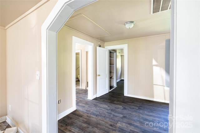 corridor with dark hardwood / wood-style flooring